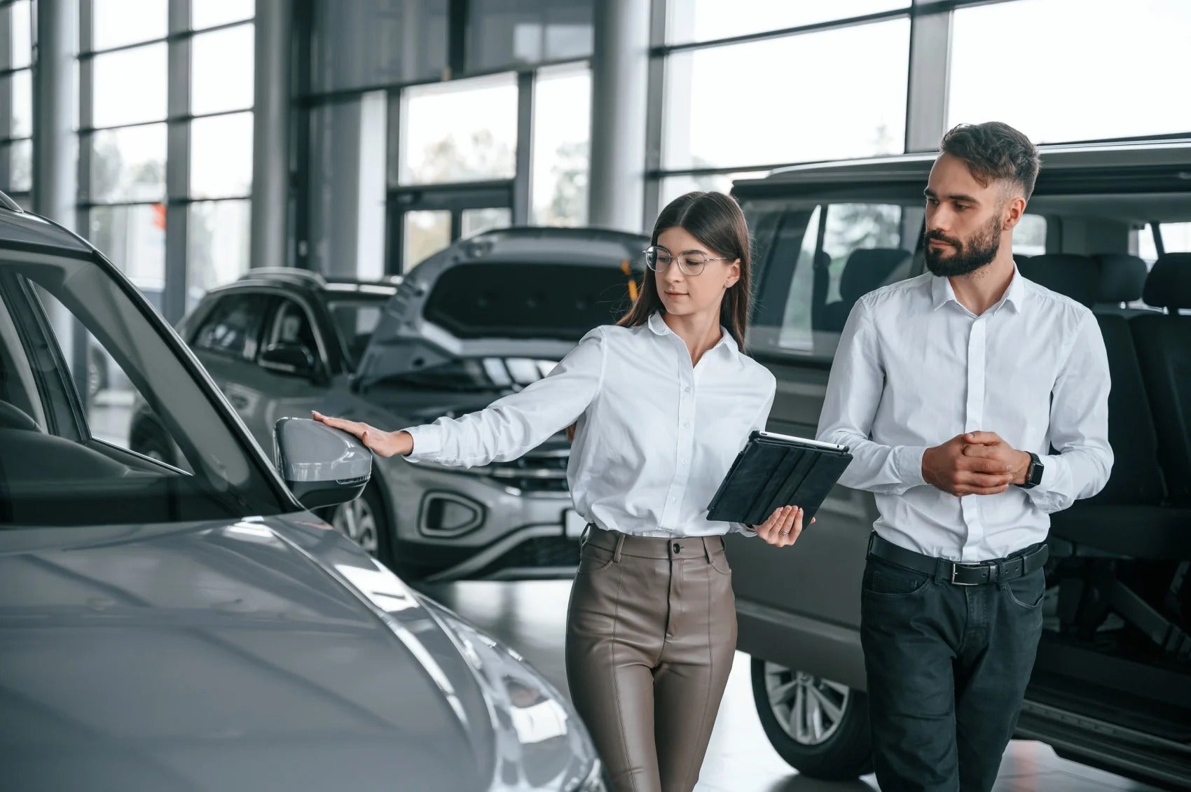 Young driver working with salesperson