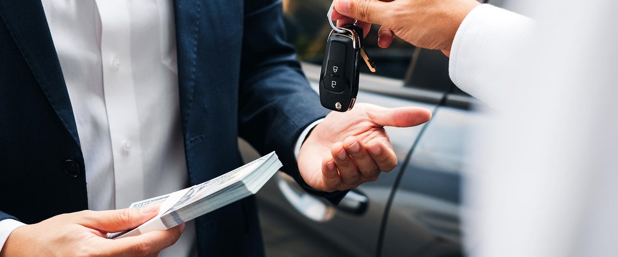 Salesperson handing customers keys